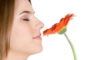 woman-smelling-flowers